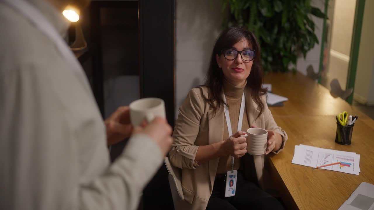 Business professionals discussing work in an office