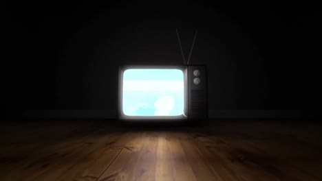 Formas-Abstractas-En-La-Pantalla-Del-Televisor-Sobre-Una-Superficie-De-Madera-Sobre-Fondo-Negro.