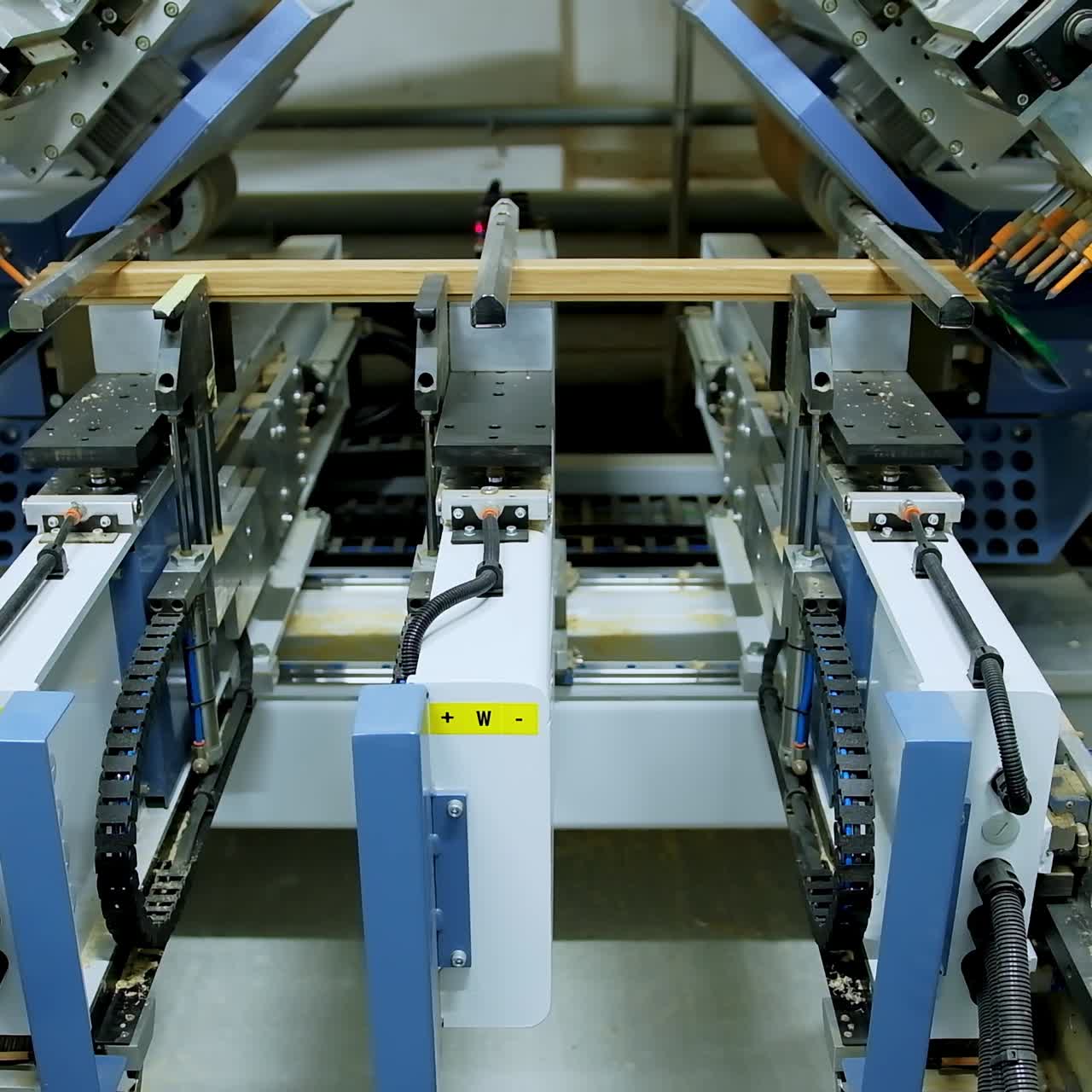 Robotic device for door production. Modern automated equipment making doors in a workshop. Front view.