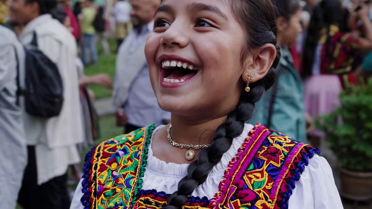 Vibrant street scene video capturing a lively crowd in traditional attire, shot from a side angle