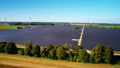 solar panels farm field of green renewable energy