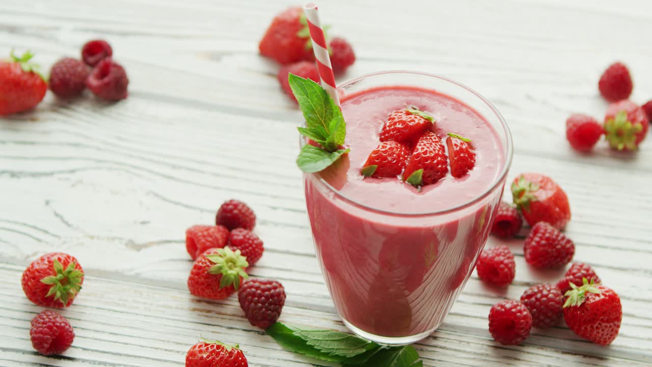 Strawberry smoothie in glass with mint