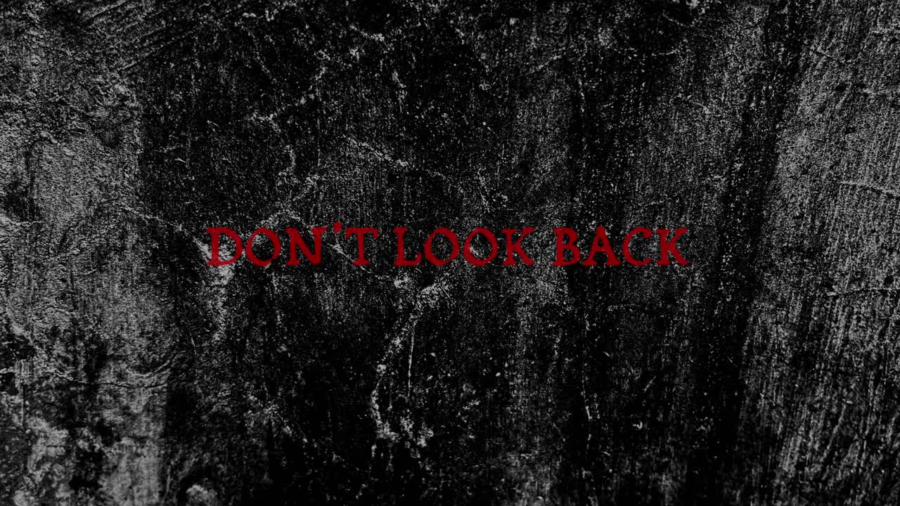 Don't Look Back Red Text on Dark Grunge Background