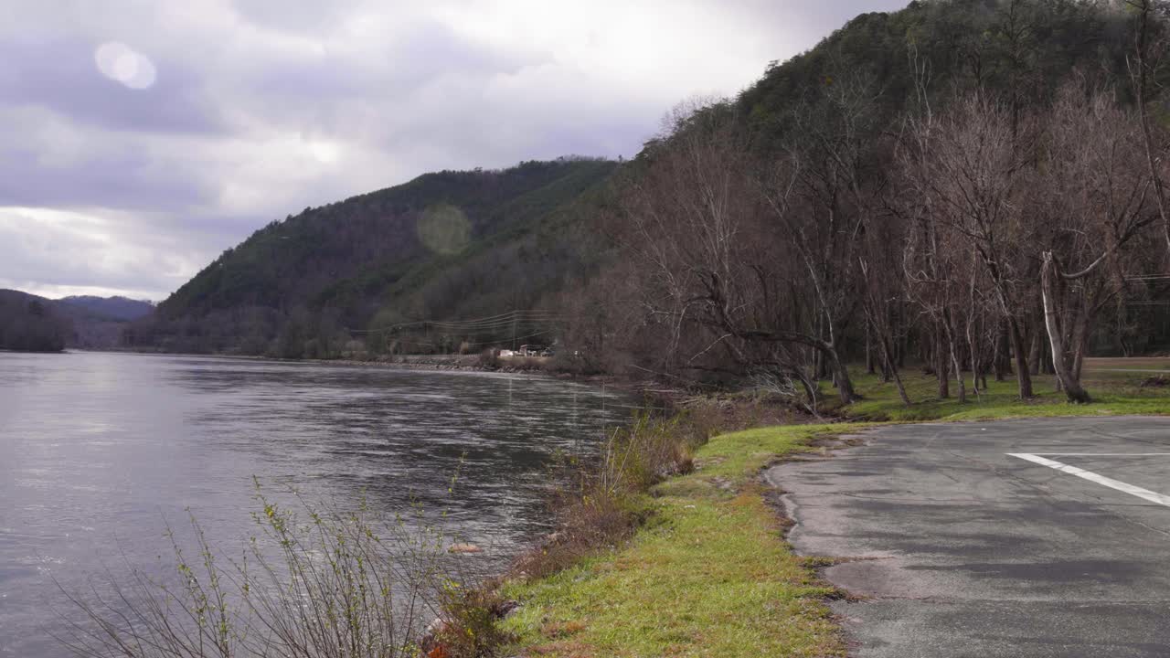 Wide shot of Lake Tellico and a parking lot in Tennessee.