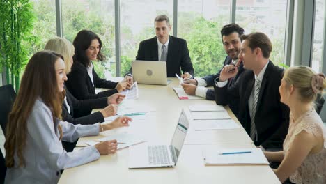 group of diverse business people meeting on window  in office . marketing team brainstorming in conference together at workspace.discussion corporate teamwork talking to strategy analysis  financial .