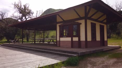 Gimbal-shot-booming-down-and-panning-to-the-surviving-train-station-from-the-2018-Woolsey-Fire-that-destroyed-Paramount-Ranch-in-Agoura-Hills,-California