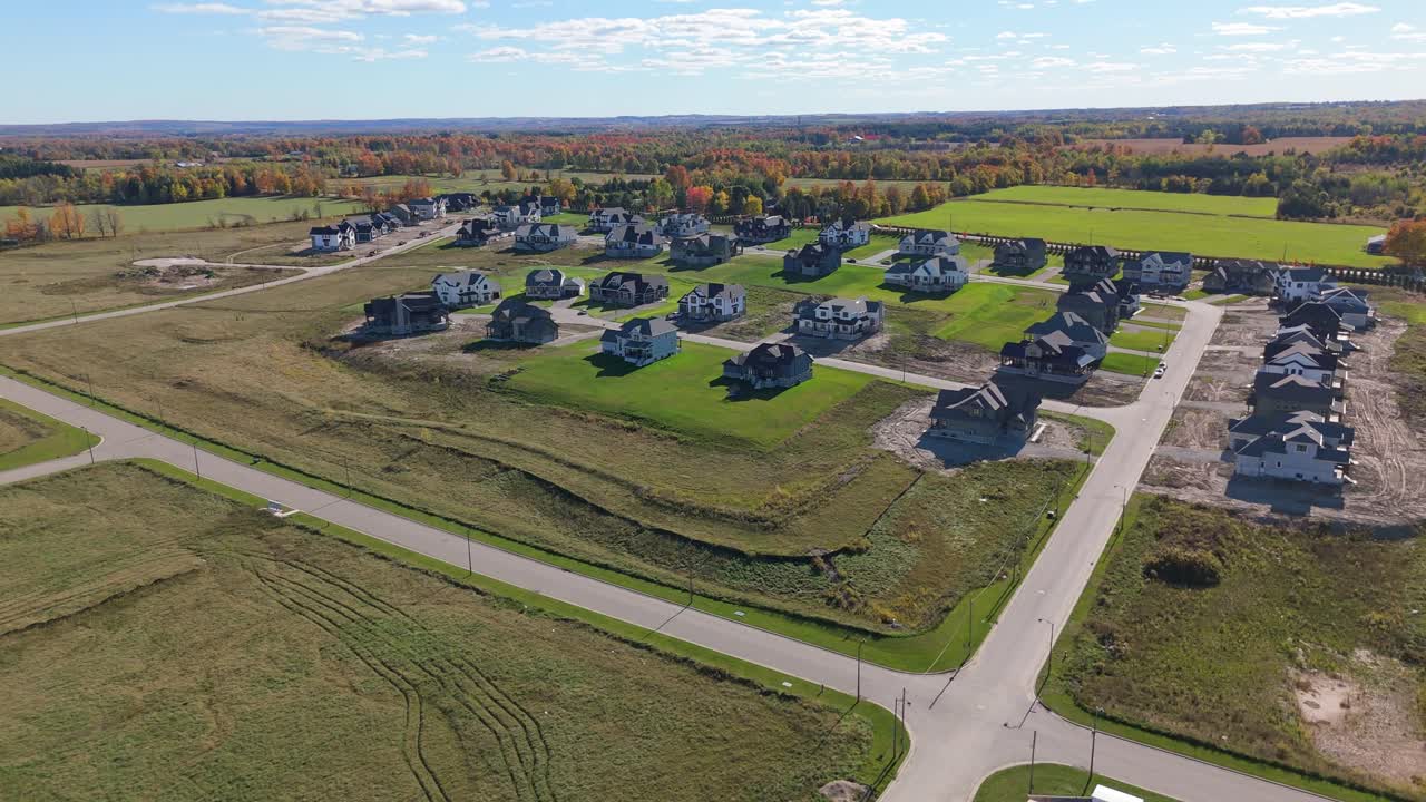Aerial view of a growing housing development in Alton, Caledon, Ontario, showing new detached homes, empty lots, and expanding suburban planning amid Ontario’s ongoing housing shortage