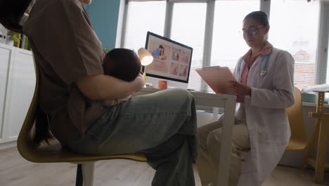 mother and baby at clinic with doctor
