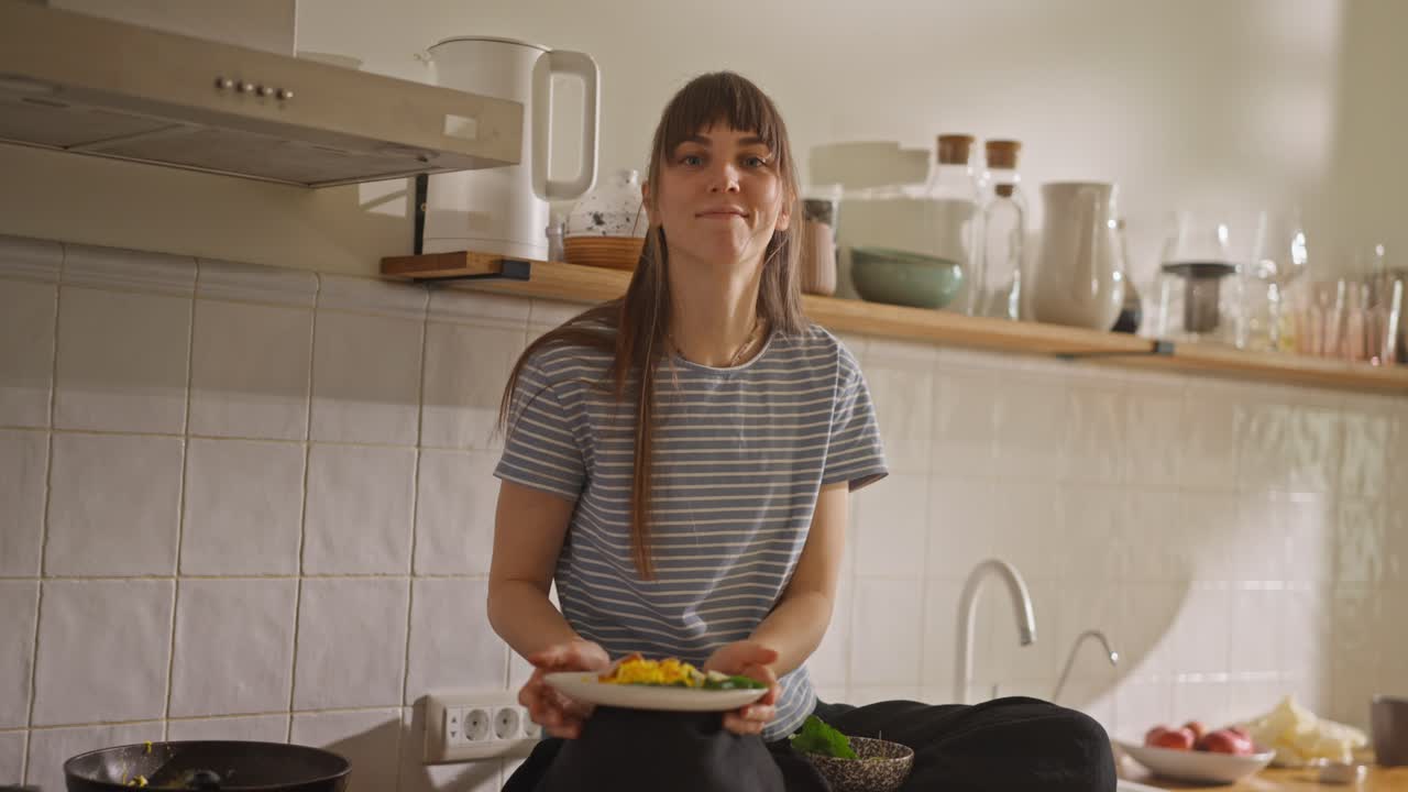 Woman in kitchen with food
