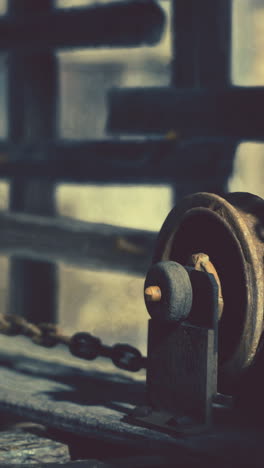 close-up of an old rusty pulley and chain