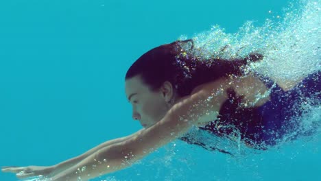 woman swimming underwater