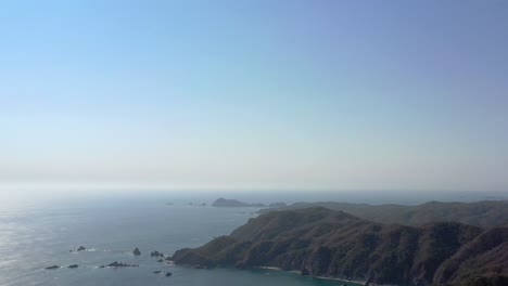 stunning aerial view of mountains and blue ocean in mexico