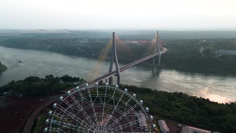 A-drone-gracefully-retreats,-revealing-the-marvelous-confluence-of-two-rivers-at-Hito-Tres-Fronteras,-where-Argentina,-Paraguay,-and-Brazil-converge-in-an-awe-inspiring-natural-spectacle