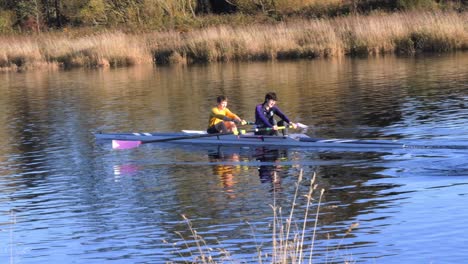 two students sculling on the river dee