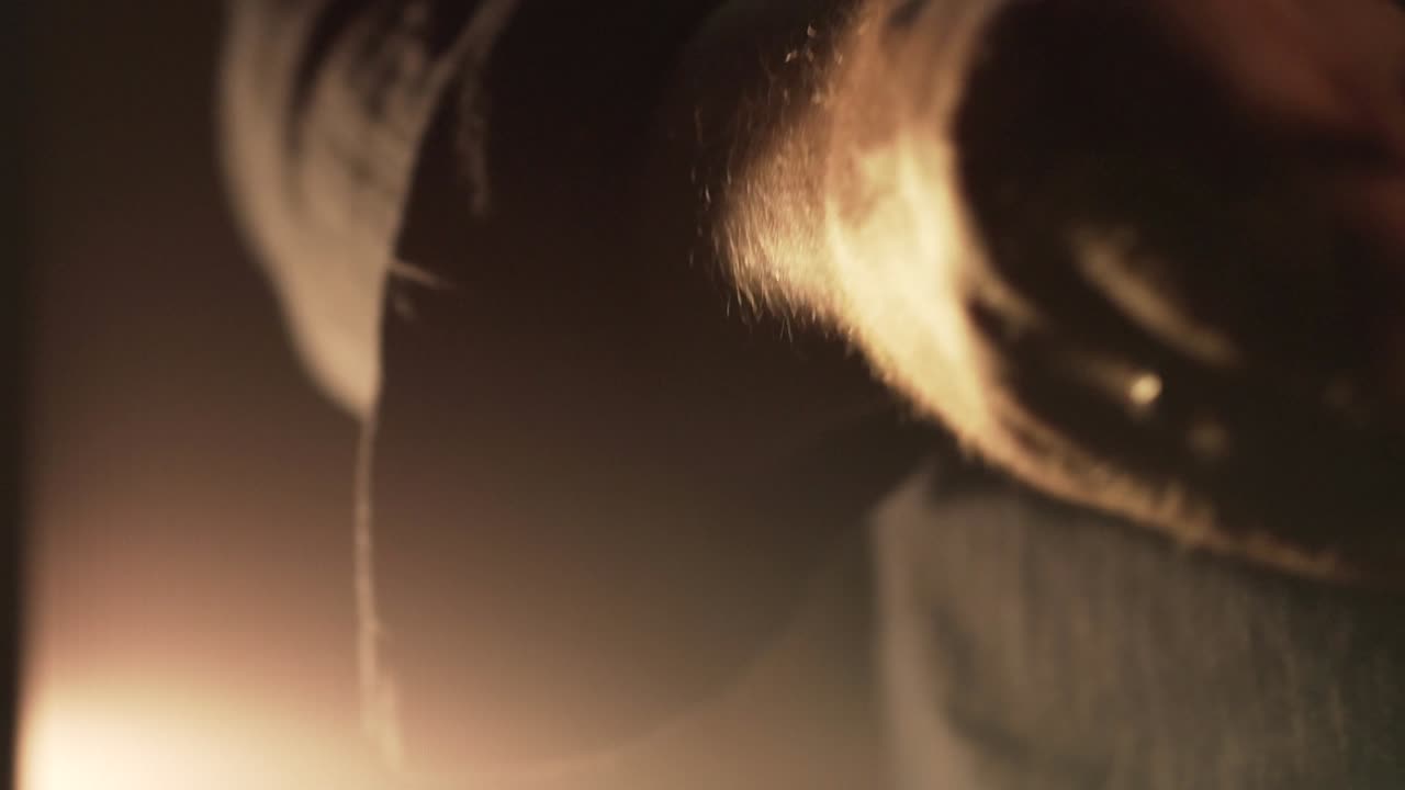 Person holding a knife in low-light