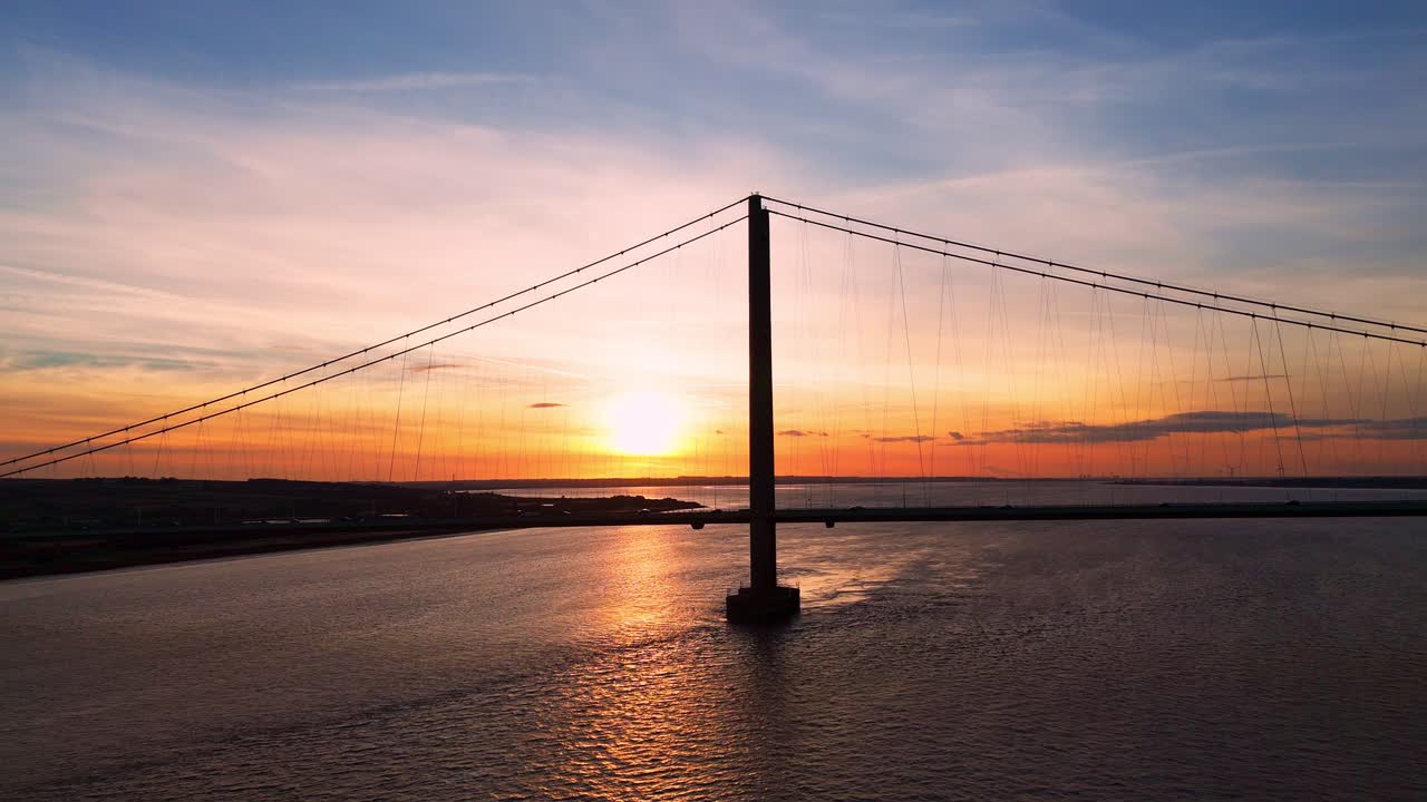 A cinematic masterpiece: Humber Bridge and cars at golden hour