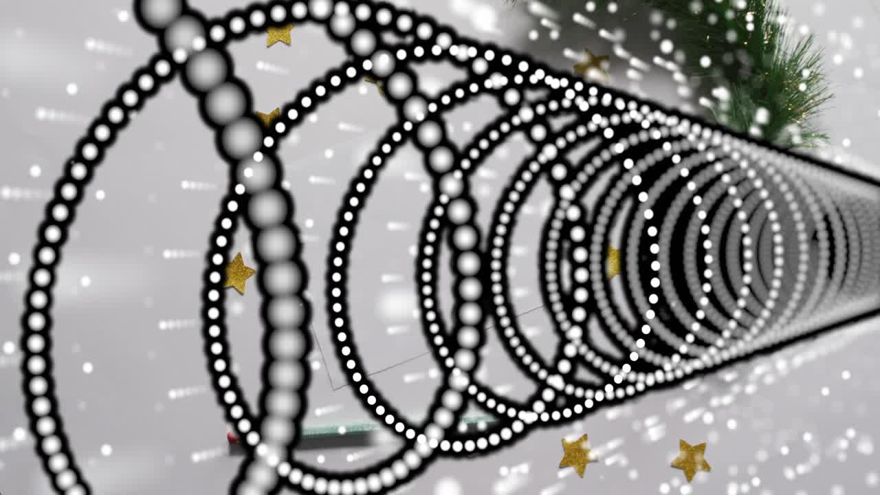 Camera moving forward to spiral beads showing snow stars pine tips and pencil forming festive scene