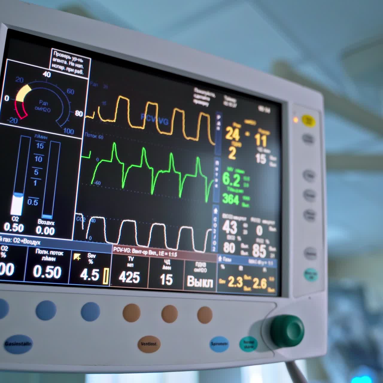 Modern medical operation room with monitor. Graphic lines on the screen of monitor to show heart ecg about the patient's condition during the operation.