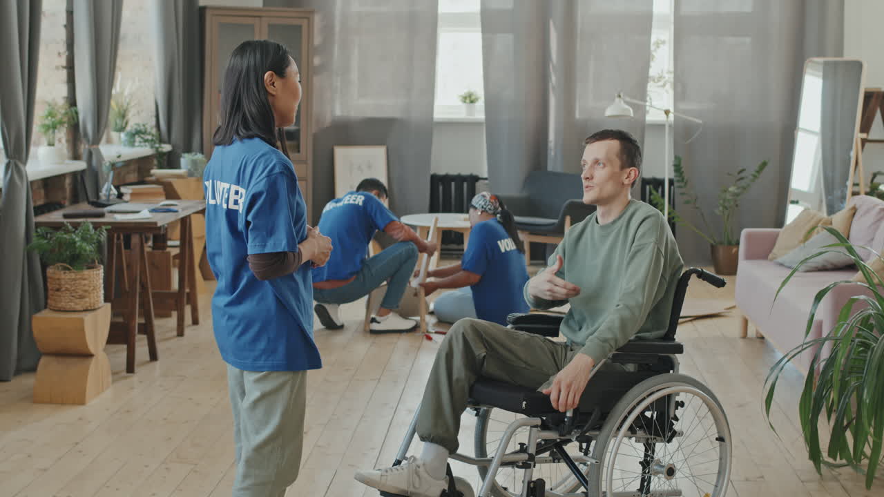 Man with Disability Meeting Volunteer at Home