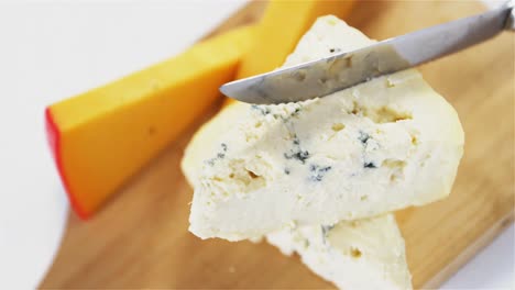 slices of cheese with knife