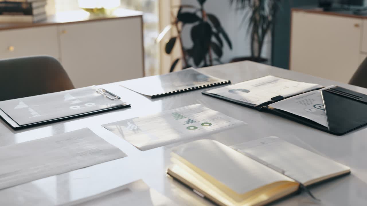 Business documents and notebook on a desk in the office