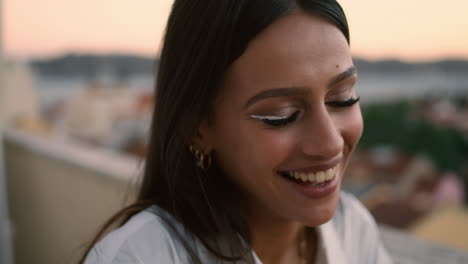 laughing woman talking balcony vertical portrait. smiling girl chatting dinner