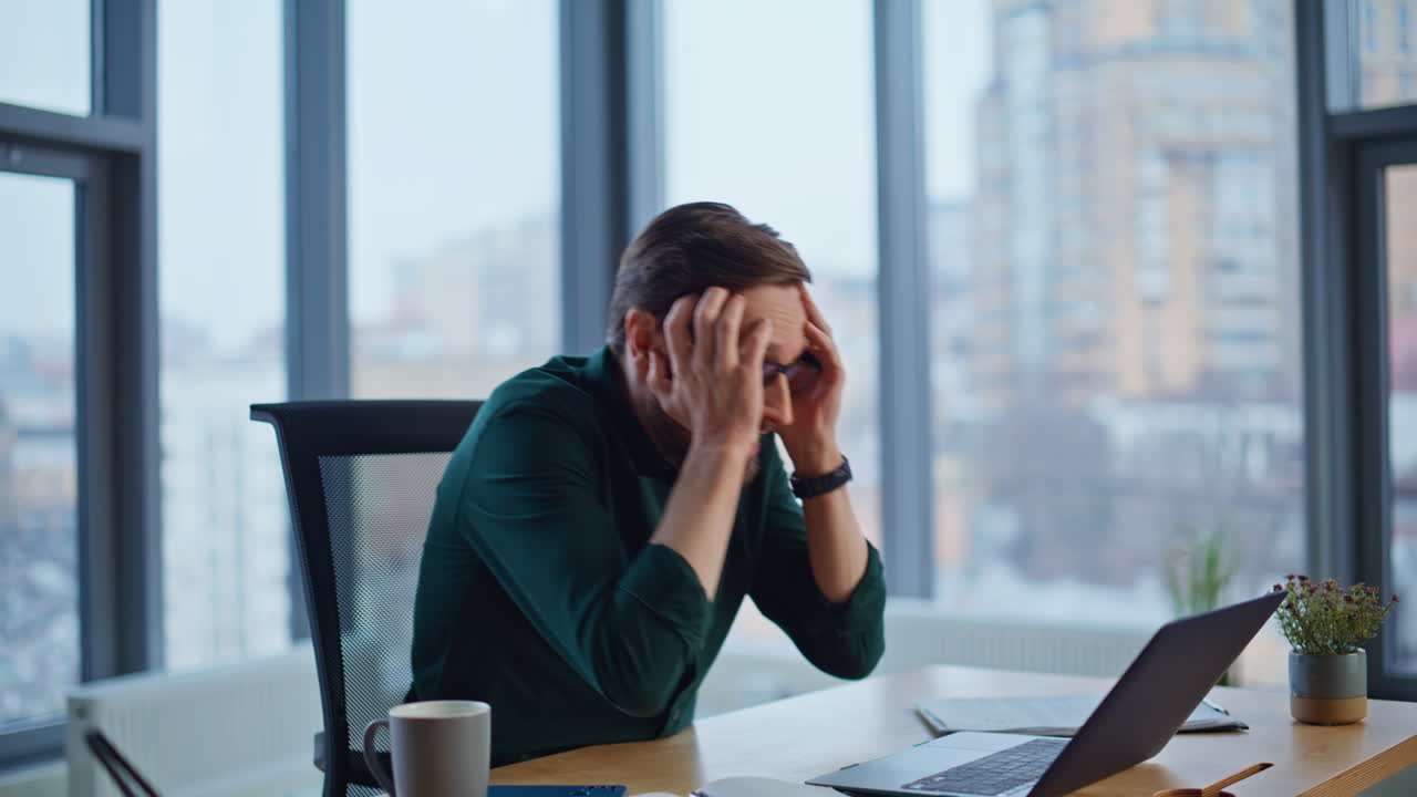 Overjoyed entrepreneur feeling success looking laptop at company office closeup