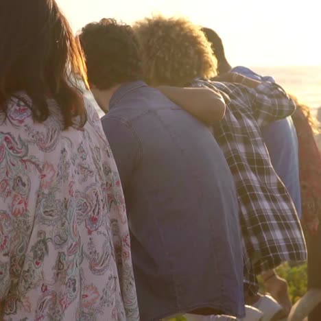 young people on wooden fence