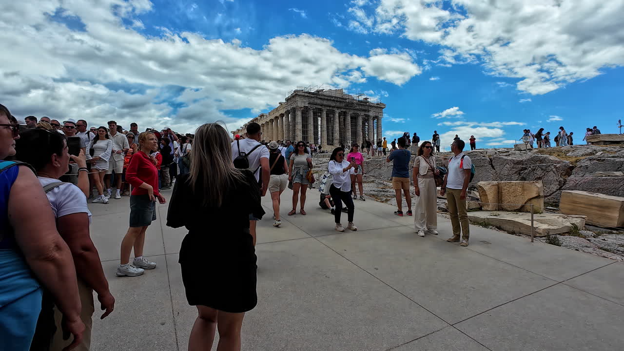 Tourists visiting the Parthenon at the Acropolis in Athens, Greece