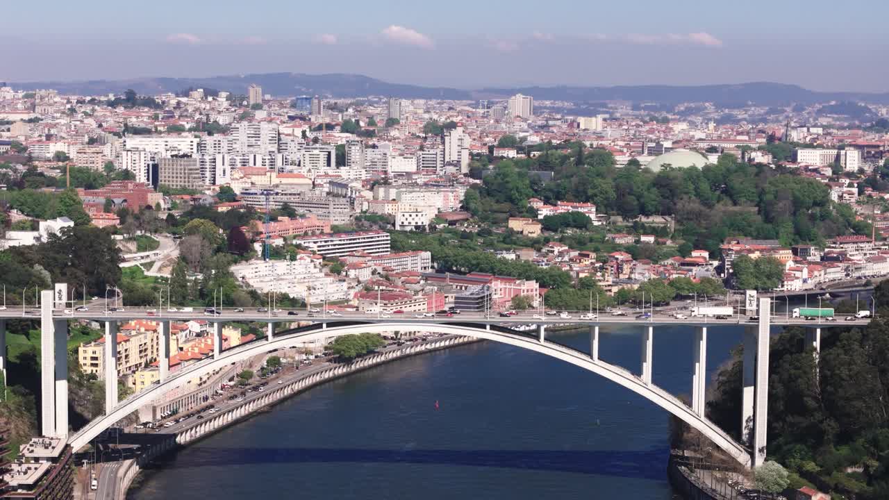Fly sideways, view of Arrábida Bridge and Porto city, Portugal