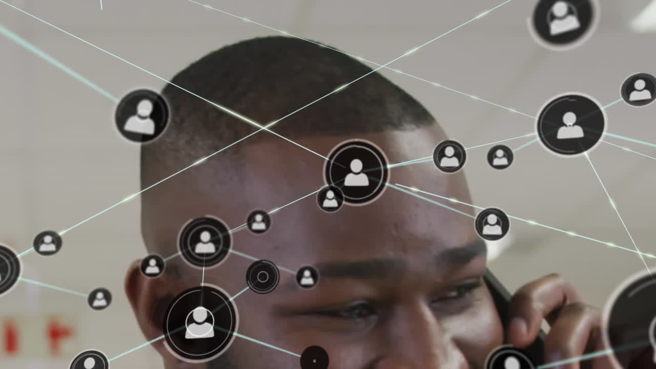 Animation of network of profile icons against close up of african american man talking on smartphone