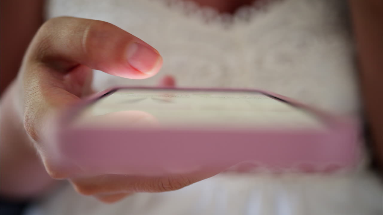 Close up of a woman scrolling on her phone