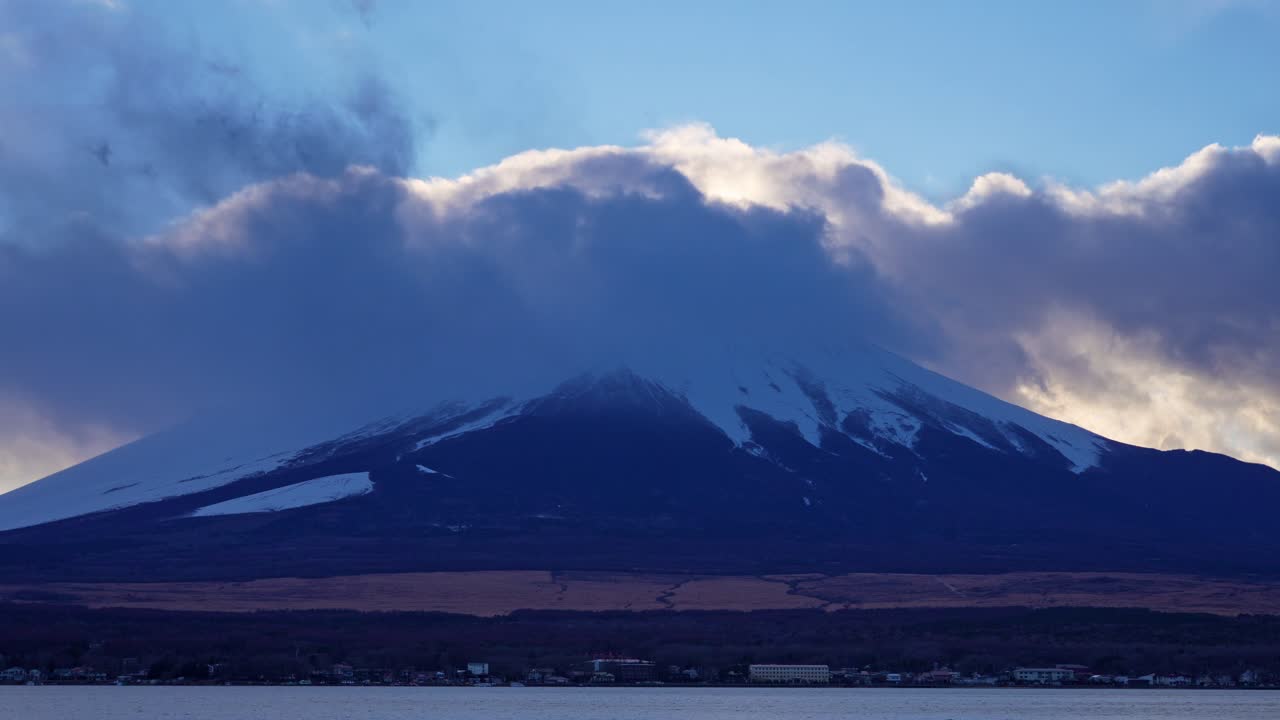 Mount Fuji during golden hour shown in a smooth panning motion across the landscape
