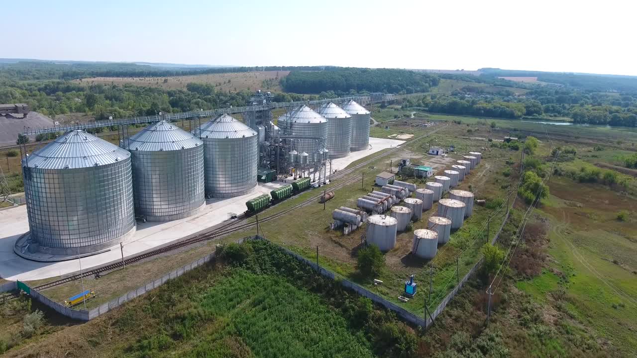 Steel Grain Silos. BAR, UKRAINE - AUGUST 2017: Aerial view of agricultural grain elevator in countryside