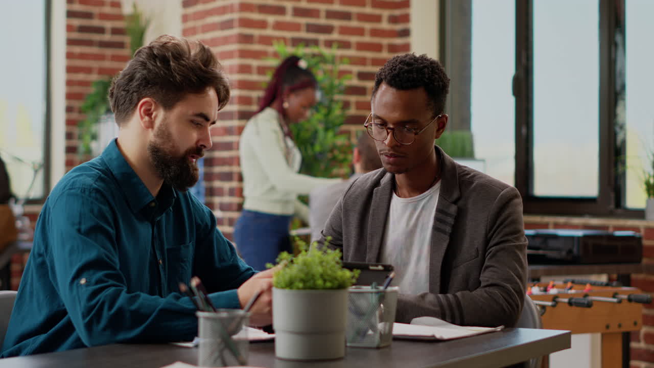 Diverse team of coworkers planning business report with data research