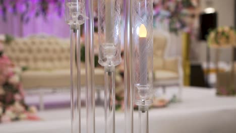 the candles decoration piece, against the backdrop of stage decorations, showcasing a breathtaking view.