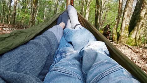 sharing a hammock in the forest