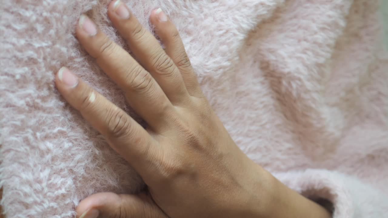 Hand on fuzzy texture
