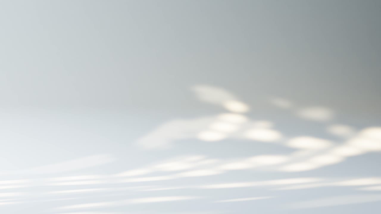Dynamic Light and Shadow Patterns Moving on a White Wall