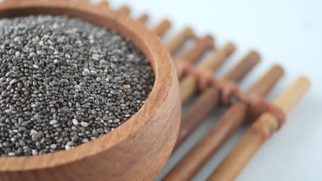 close-up of chia seeds in a wooden bowl