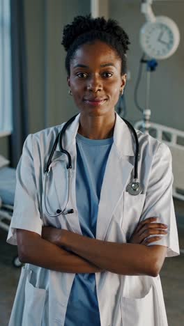 confident african american female physician standing tall in hospital room, embodying professional healthcare expertise with serene and trustworthy demeanor