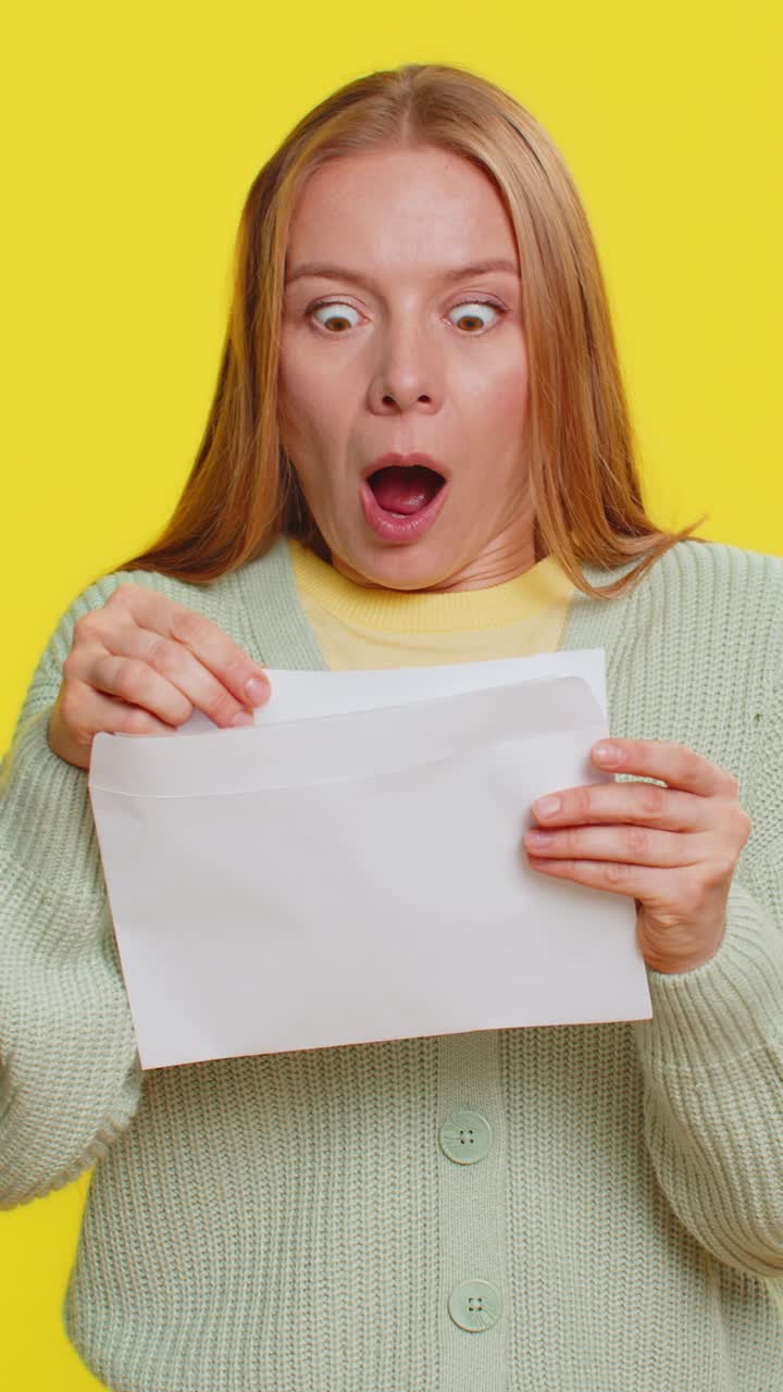 Happy young woman open envelope take out letter reads bank loan approve great news award win