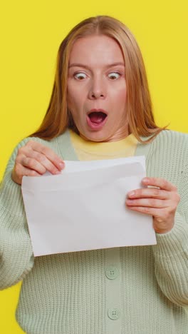 happy young woman open envelope take out letter reads bank loan approve great news award win