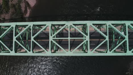 aerial view of easton pa and delaware river with cars driving on the bridge from a birds eye view