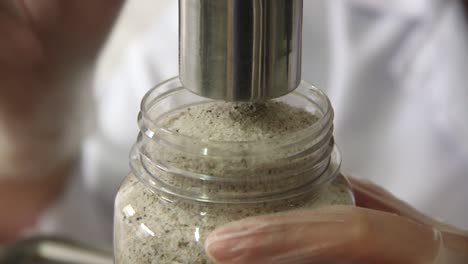 machine bottling seasonings in a factory