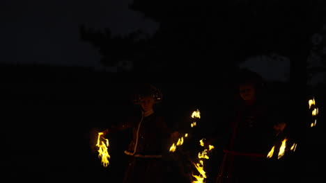 fire jugglers at night