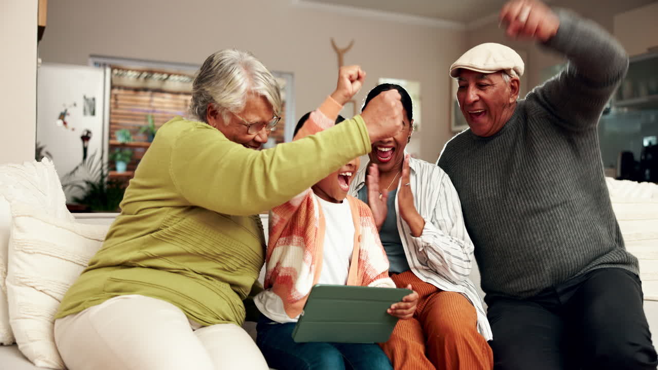 A family celebrating together while using a tablet