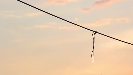 Time-lapse-of-a-string-on-a-line-at-dusk