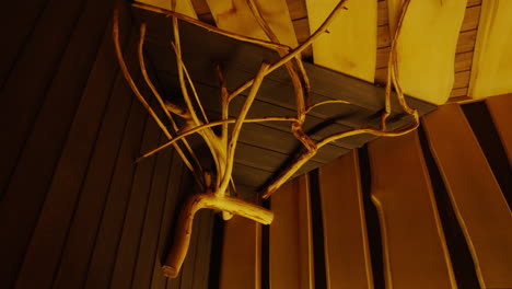 rustic wooden branch decor on interior wall