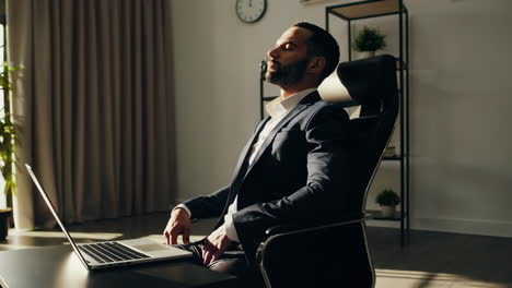 businessman relaxing in office chair